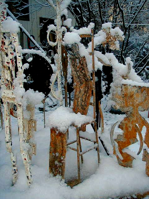 metal figures in snow