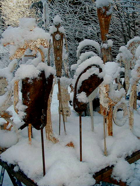 metal figures in snow