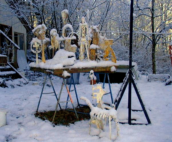 metal figures in snow